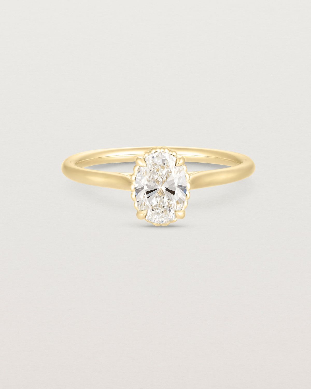 anne_oval_cut_lab_diamond_dotted_rail_solitaire_engagement_ring_1
