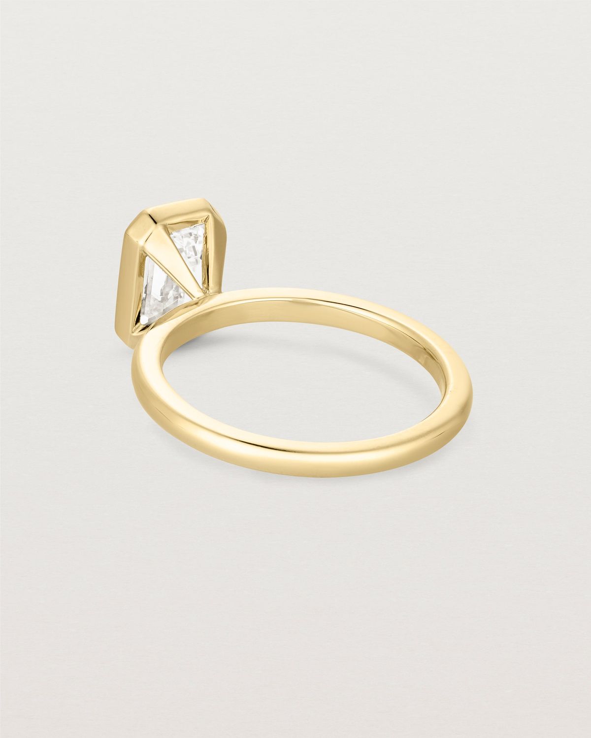 louisa_emerald_cut_lab_diamond_bezel_solitaire_engagement_ring_6
