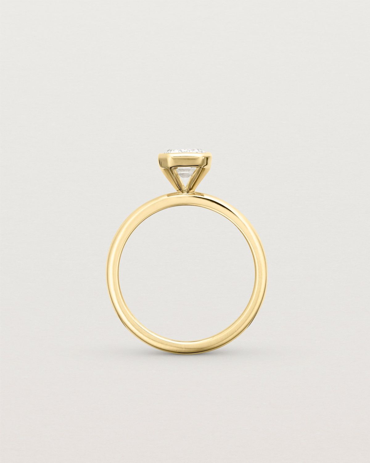 louisa_emerald_cut_lab_diamond_bezel_solitaire_engagement_ring_7