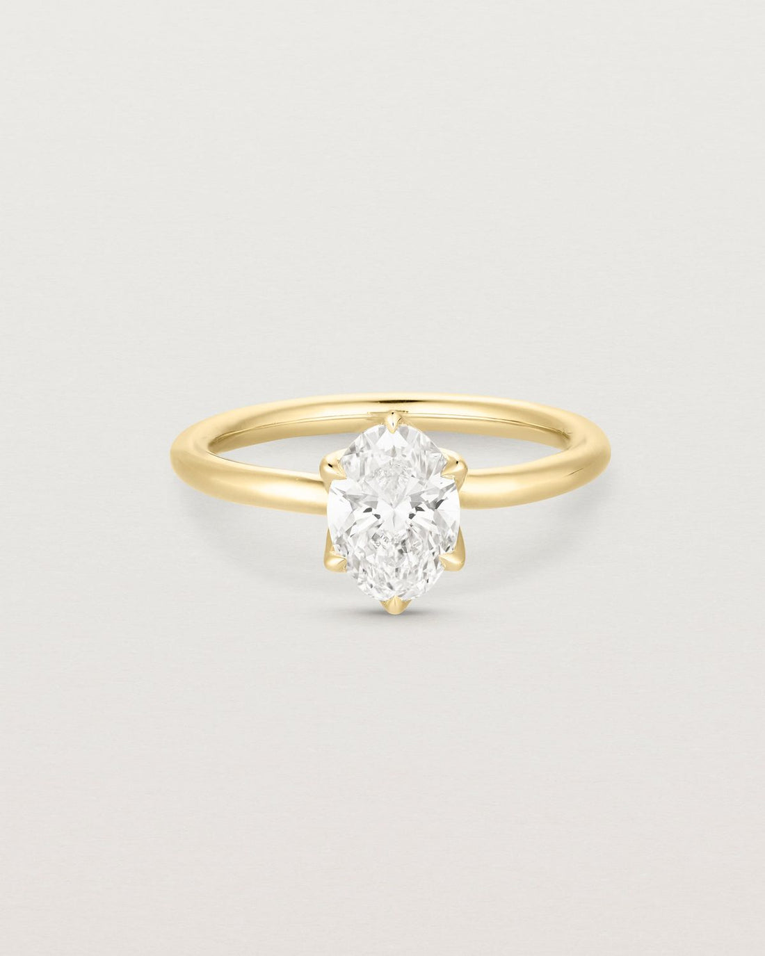 zora_oval_cut_lab_diamond_solitaire_engagement_ring_with_petal_prongs_1